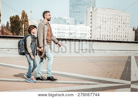Father Picking His Son From The School