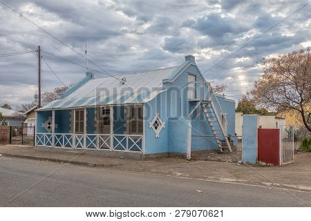 Carnavon, South Africa, September 1, 2018: An Early Morning Street Scene, With An Historic House Wit