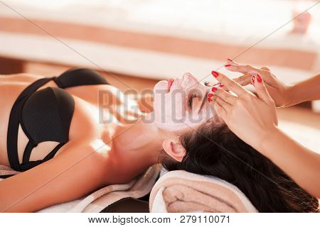Spa Mask. Beautiful Woman Get Spa Mask On The Sunny Beach In Spa Salon Outdoor. High Quality. Scin C