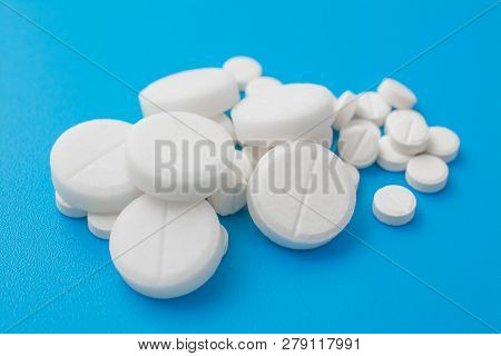 Pharmacetic Concept: Pills Top View On Blue Background