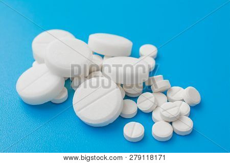 Pharmacetic Concept: Pills Top View On Blue Background