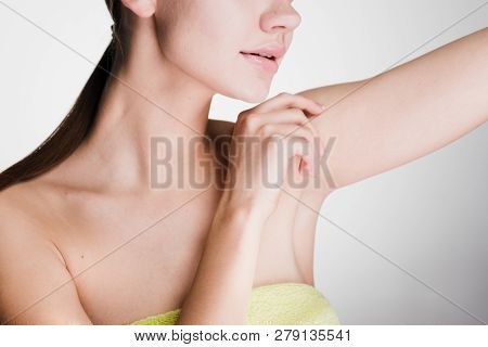 Woman After The Shower Takes Care Of The Skin Underarms