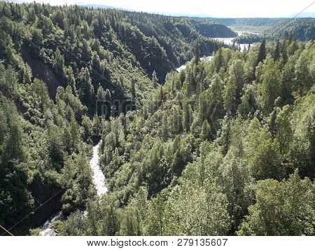 View Of Hurricane Gulch From A Railroad Bridge In Alaska