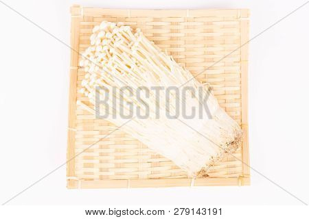 Japanese Mushrooms Enokitake In A Bamboo Plate On White Background. Flat-lay, Top View.