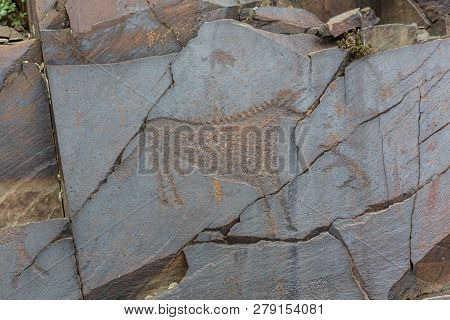 The Ancients Petroglyphs In Tamgaly Tash In Kazakhstan