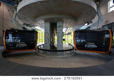 TYROL, AUSTRIA - JULY 2018 : Stubaier Gletscher gondola lift approaching station at Stubai Glacier in Tyrol, Austria on July 26, 2018. 