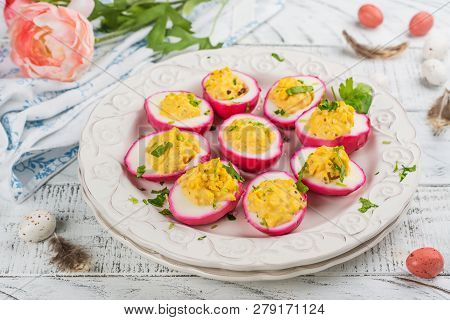 Beet-dyed Deviled Eggs. Easter Stuffed Eggs On White Wooden Background. Copy Space
