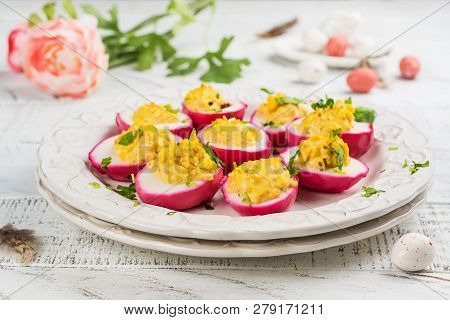 Beet-dyed Deviled Eggs. Easter Stuffed Eggs On White Wooden Background. Copy Space