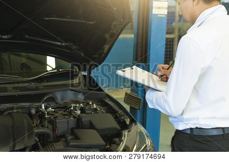 This Career Man Saleman Business Inspection Writing Note On Notepad Or Book, Paper With Car Blurry B