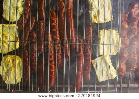 Sausages And Halloumi Cheese On The Bbq,  Closeup For The First Bbq Of The Year, Cyprus Greek Cheese