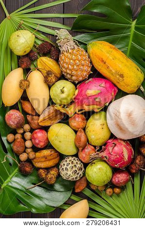 Summer Detox With Vegan Food. Assorted Thai Tropical Fruits On A Dark Wooden Rustic Background.