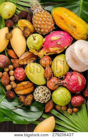 Summer Detox With Vegan Food. Assorted Thai Tropical Fruits On A Dark Wooden Rustic Background.
