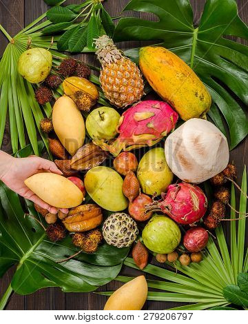 Summer Detox With Vegan Food. Assorted Thai Tropical Fruits On A Dark Wooden Rustic Background.