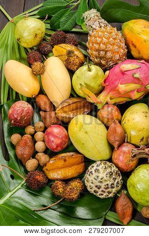 Summer Detox With Vegan Food. Assorted Thai Tropical Fruits On A Dark Wooden Rustic Background.