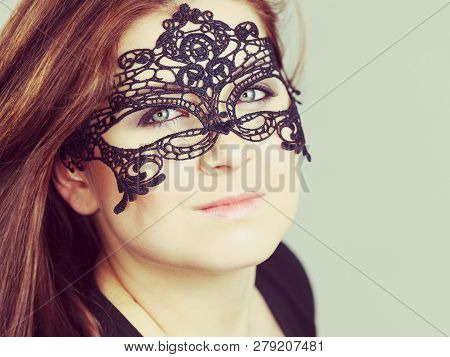 Pretty Mysterious Woman Wearing Black Eye Lace Mask Having Long Brown Hair.