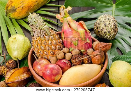 Summer Detox With Vegan Food. Assorted Thai Tropical Fruits On A Dark Wooden Rustic Background.