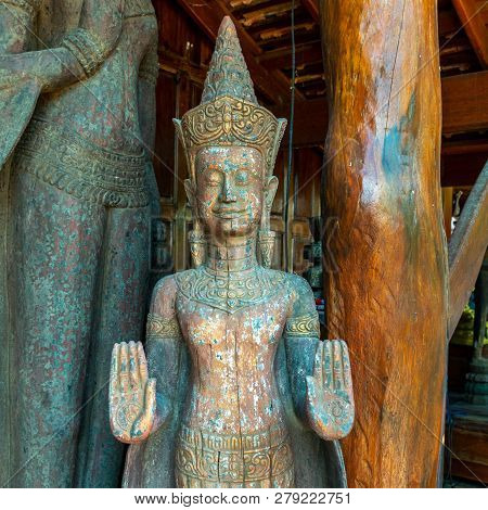 Wheel Of Dhamma On Palm Of Old Buddha Statue