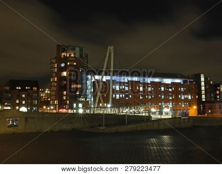 A Cityscape View Of The Canal Entrance To The Clarence Dock Area Of Leeds With A Pedestrian Bridge C