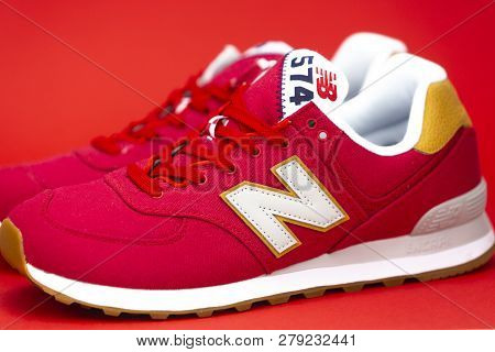 Boston, Ma, Usa, January 2019 - Red New Balance Nb 574 Athletic Shoes On Studio Background. New Bala