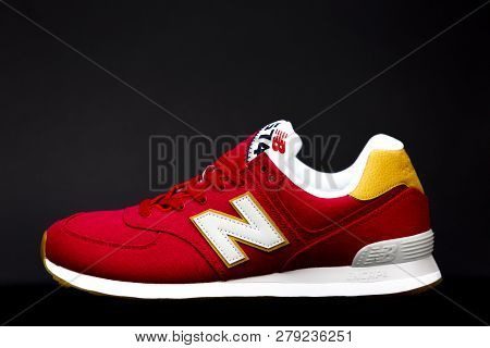 Boston, Ma, Usa, January 2019 - Red New Balance Nb 574 Athletic Shoes On Black Studio Background. Ne