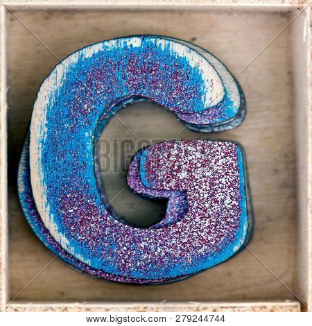 old wooden letter  AGin a box shot from above macro image 