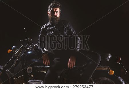 Macho, Brutal Biker In Leather Jacket Stand Near Motorcycle At Night Time, Copy Space. Biker Culture