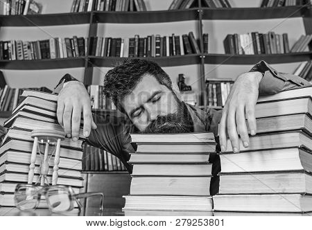 Teacher Or Student With Beard Fall Asleep On Books, Defocused. Man On Sleeping Face Lay Between Pile