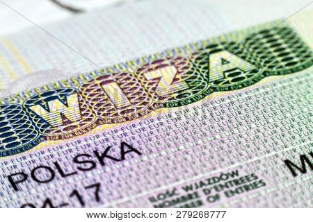 Close Up Of Visa In Passport. Poland Of Shengen Travel Concept.