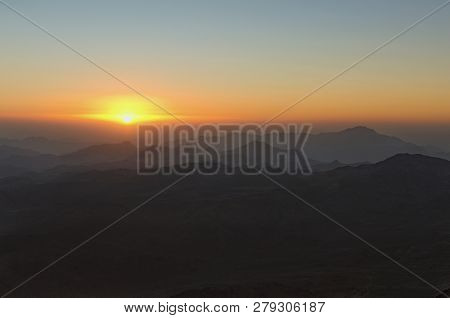 Amazing Golden Sunrise In The Mountains. White Sun Disk On The Mountains. View From Mount Sinai (mou