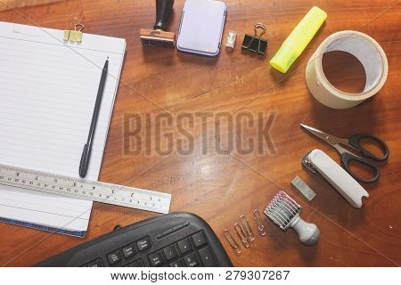 Office Suply With Stamp Scissors Clip Ruler Accessories Equipment And Tape On The Top View And Woode