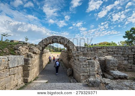 Olympia, Greece - October 31, 2017: Tourists Visiting The Ancient Olympia. The Entrance In Ancient O