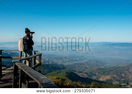 Professional Photographer Take Landscape Photos By Camera On Mountainon , Travel , Backpack