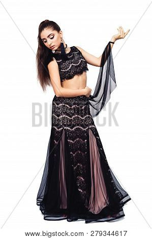 Graceful Young Girl Bellydancer With Oriental Make-up Posing In A Costume Of Raqs Sharqi. Isolated O