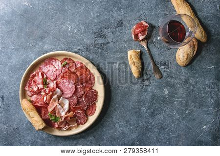 Antipasto Meat Platter Assorti Of Sliced Jamon, Salami, Chorizo Sausage In Ceramic Plate With Bread 