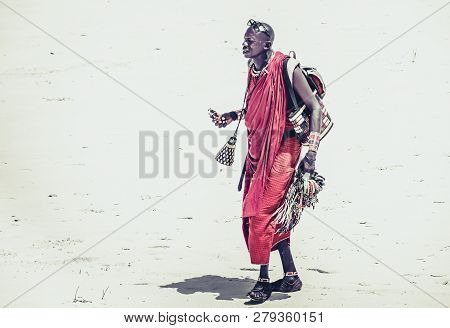 Diani Beach, Kenya - October 14, 2018: Unindentified African Man Wearing Traditional Masai Clothes O
