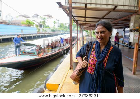 Indian Woman At Canal Boat Station In Bangkok Thailand