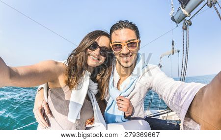 Young Lover Couple Taking Selfie On Sailing Boat Tour Around The World - Love Concept At Jubilee Par