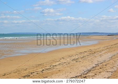 Sandy Beach On The Coast Of Normandy, France