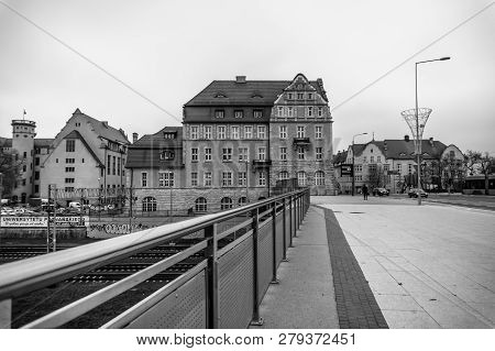 Poznan, Poland - November 21, 2018: Metal Barrier Next To A Sidewalk Leading The The Adam Mickiewicz