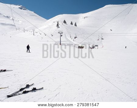 Skier In A Slope Of A  Winter Ski Resort
