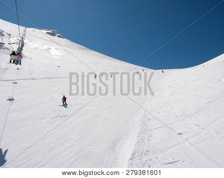 Skier In A Slope Of A  Winter Ski Resort