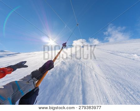Details Of Snowboarders On The Slope