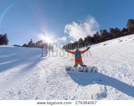 Happy Snowboarder On The Slope