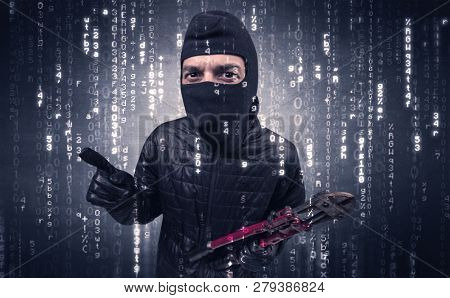 Burglar in action with encoded concept and his tools in his hand. 
