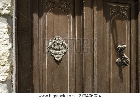 Close-up. Vintage Knob For Knocking On The Door And A Decorative Element With Birds.