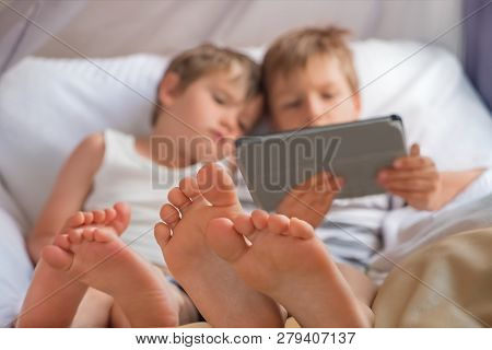 Children And Gadgets Kids With Tablet Alternative Education Concept Social Communication Disorder. E