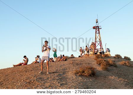 Cabo De La Vela, Colombia - August 23, 2015: People Watch The Sunset On The Hill Near Cabo De La Vel