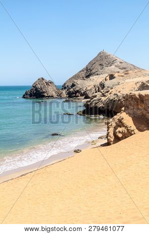Coast Of La Guajira Peninsula In Colombia. Beach Playa Del Pilon. Pilon De Azucar Hill In The Backgr