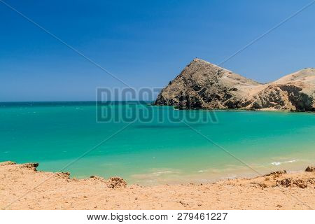 Coast Of La Guajira Peninsula In Colombia. Pilon De Azucar Hill In The Background.