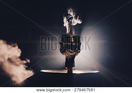 Hookah Bowl With Flawoured Tobacco And Red Hot Coconut Coil On The Black Background With Light Close
